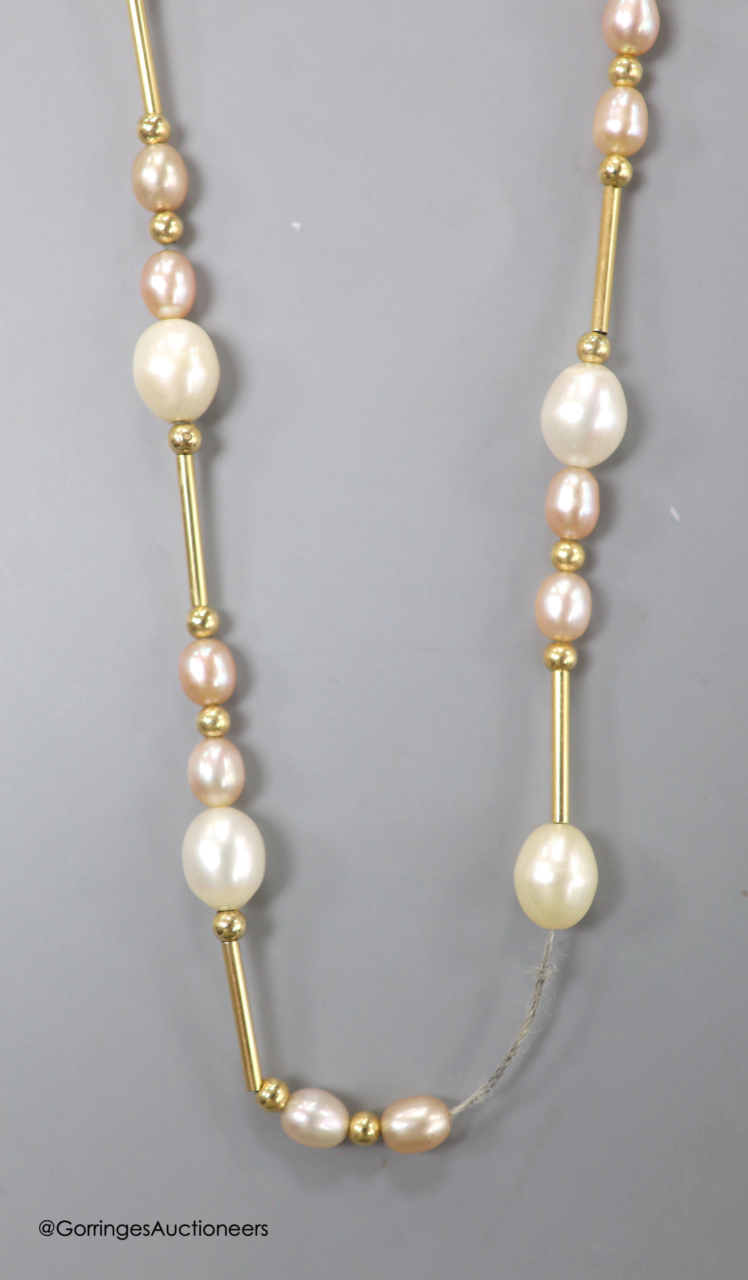 A modern 14kt yellow metal and graduated cultured pearl bar and cluster set necklace, 44cm, gross weight 11.3 grams.